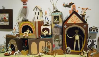 display of sculptures of houses and little figures